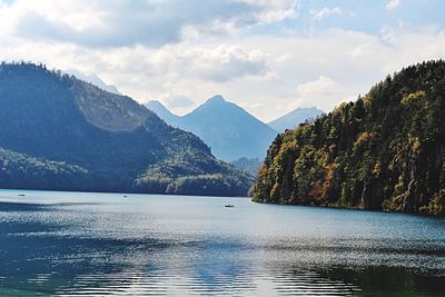 Scenic view of lake against cloudy sky