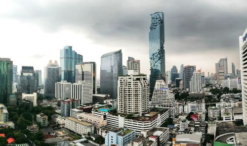 Modern buildings in city against sky