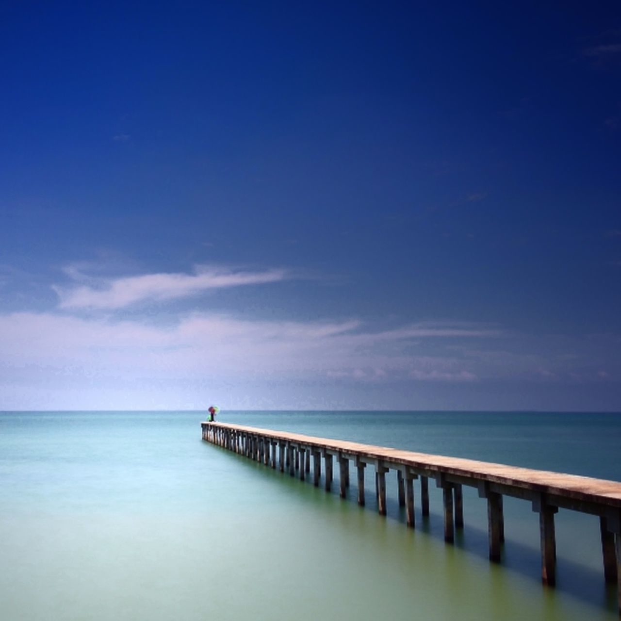 PIER ON SEA AGAINST SKY