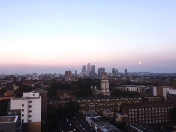 High angle shot of cityscape against sky at sunset