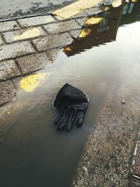 High angle view of puddle on street