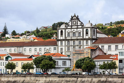 Buildings in city against sky