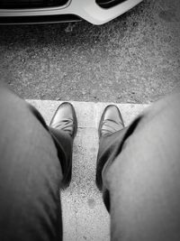 Low section of man standing on floor