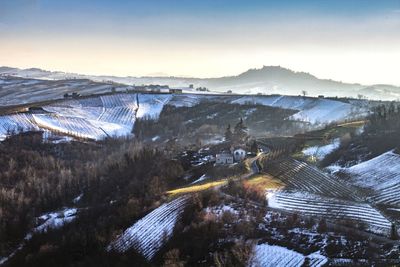 High angle view of snowcapped mountains against sky