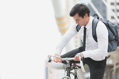 Young man riding bicycle