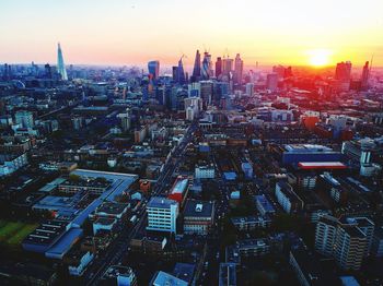 High angle view of buildings against sky during sunset