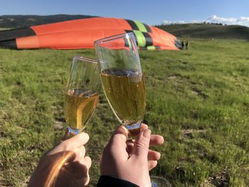 Cropped image of hands holding champagne