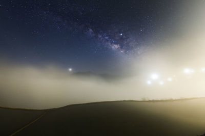 Scenic view of star field against sky at night