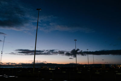 Low angle view of silhouette buildings against sky at sunset