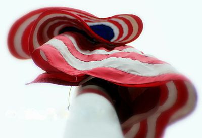 Close-up of red umbrella against white background
