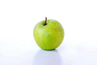 Close-up of apple against white background