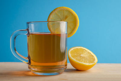 Close-up of yellow drink on table