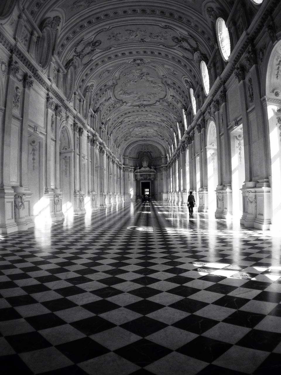 indoors, ceiling, corridor, arch, architecture, built structure, flooring, the way forward, men, tiled floor, lifestyles, architectural column, tunnel, diminishing perspective, interior, illuminated, person, walking