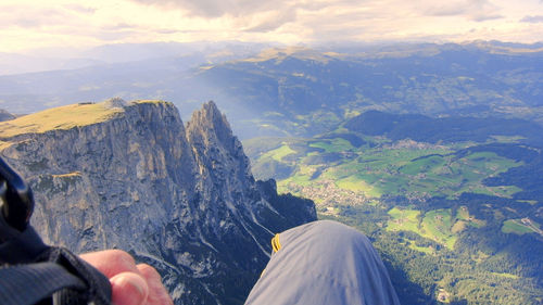 Low section of person standing on mountain