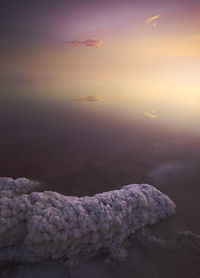 Lake with clear pink water and salt located in famous national park in torrevieja city of spain in evening time during sunset