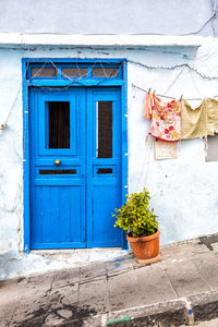 Closed blue door of building