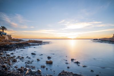 Scenic view of sea against sky during sunset