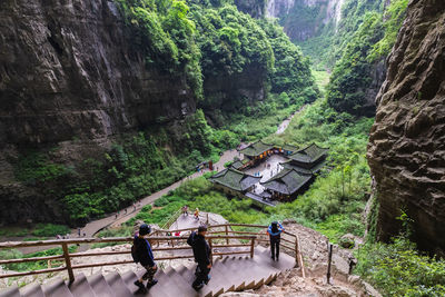 People on mountain road in forest