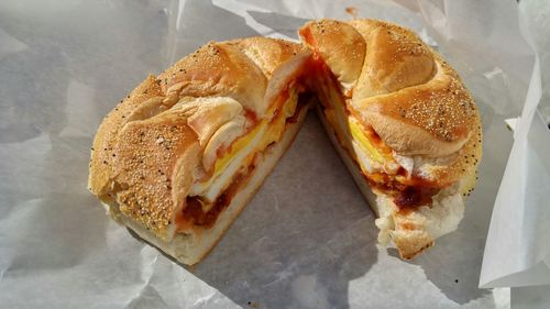 Close-up of egg sandwich on wax paper