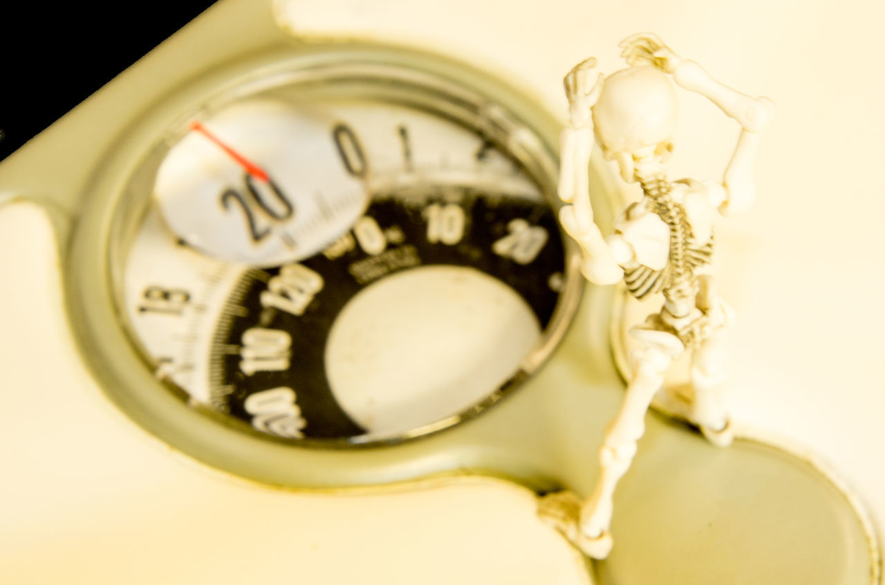 HIGH ANGLE VIEW OF CLOCK ON METAL