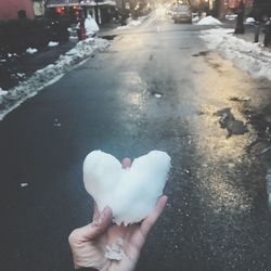 Close-up of hand holding heart shape ice cream