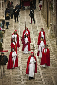 Red men standing on footpath