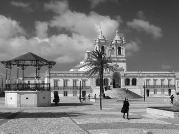 Exterior of cathedral against cloudy sky