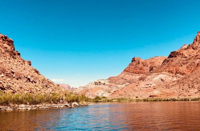 Scenic view of mountains against clear blue sky