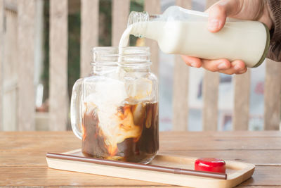 Close-up of drink in glass jar on table