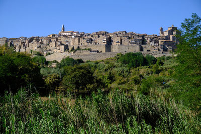 Low angle view of castle against clear blue sky