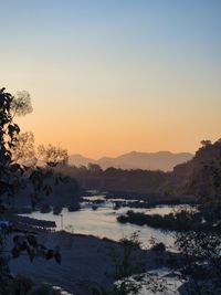 Scenic view of sea against clear sky during sunset