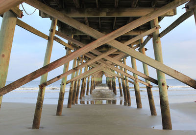 View of pier over sea against sky