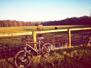 Bicycle parked against clear sky