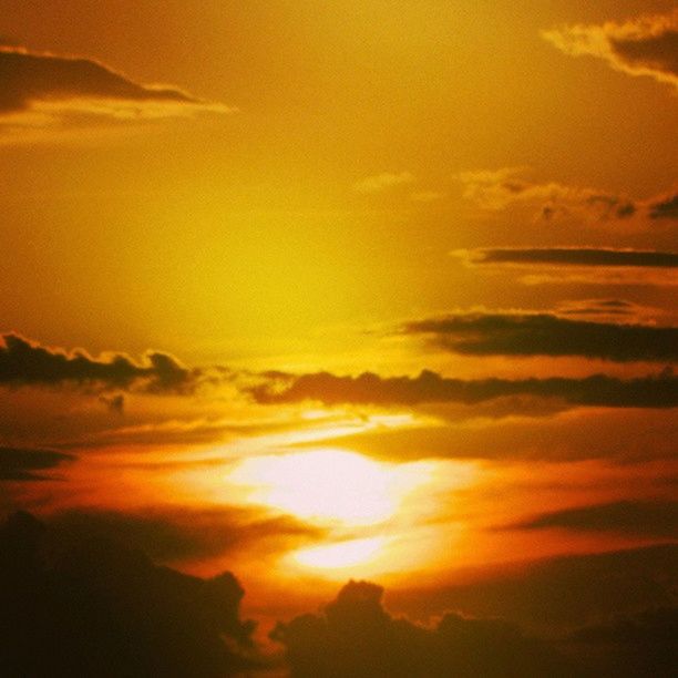 sunset, orange color, sky, beauty in nature, scenics, tranquility, tranquil scene, cloud - sky, idyllic, nature, sun, low angle view, dramatic sky, silhouette, majestic, cloud, outdoors, no people, sunlight, yellow
