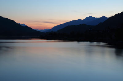 Scenic view of lake against sky during sunset