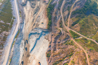 High angle view of road amidst trees on landscape