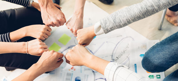 High angle view of people holding hands
