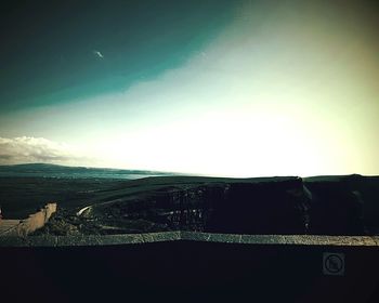 Scenic view of landscape against blue sky