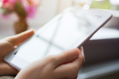 Close-up of woman using mobile phone