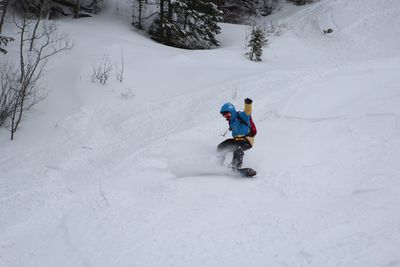 Full length of man skiing on snow