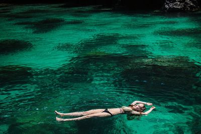 Full length of woman swimming on sea