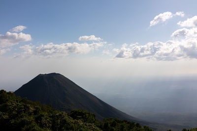 Scenic view of volcanic mountains against sky