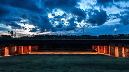 Bridge against cloudy sky at dusk