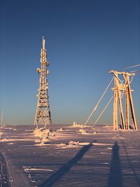 Low angle view of illuminated tower against sky