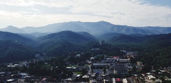 High angle view of buildings and mountains against sky