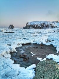 Scenic view of frozen sea against sky