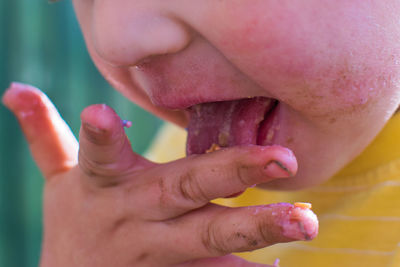 Close-up of child eating food