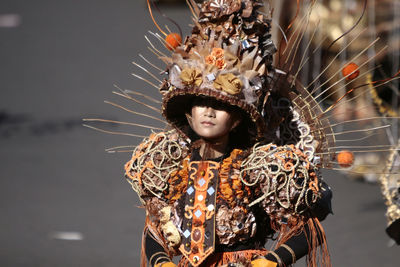 Person in costume on street during carnival