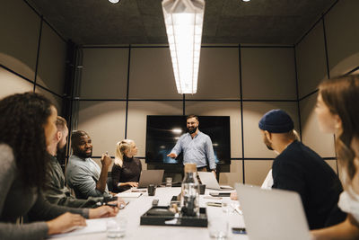 Coworkers having meeting in office