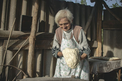 Full length of woman sitting on seat